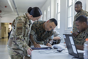 While on a mission, a JPSE member from the U.S. Air Force assists U.S. Marines. 